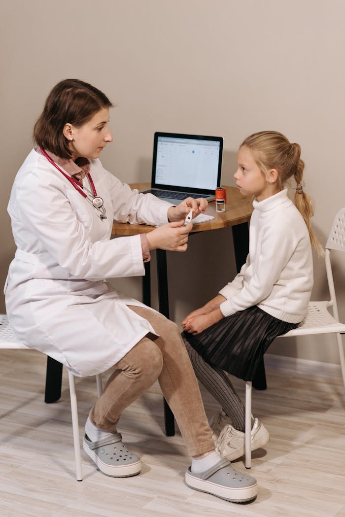 A Doctor Examining a Child Patient